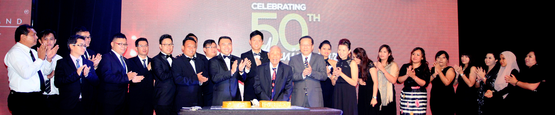 Sinaland 50th Anniversary celebration &mdash; the team and Mr. Lam Hak Ming on stage, 2014